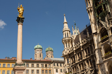 Fototapeta na wymiar Mary's Square or Marienplatz in Munich with the Marian Column, the City Hall and the domes of the Cathedral