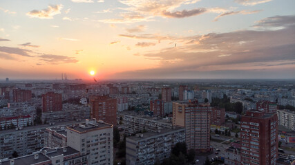 Fototapeta premium sunset over the city view from a height.