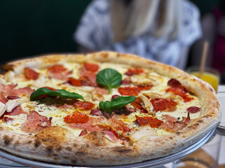 Pizza with pizza sauce, mozzarella cheese and pepperoni.