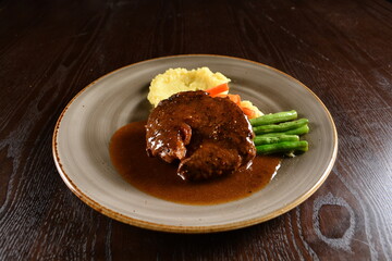 bbq grilled juicy wagyu beef tenderloin sirloin steak in brown black pepper sauce with French fries and vegetables salad dressing western cuisine menu