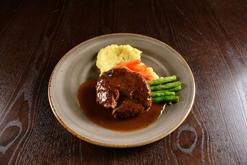 bbq grilled juicy wagyu beef tenderloin sirloin steak in brown black pepper sauce with French fries and vegetables salad dressing western cuisine menu
