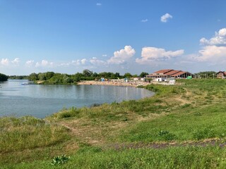 Fototapeta premium Lake view with beach and restaurant