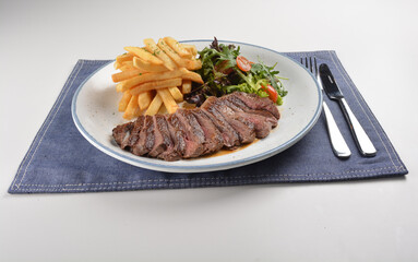 bbq grilled juicy wagyu beef tenderloin sirloin steak in brown black pepper sauce with French fries...