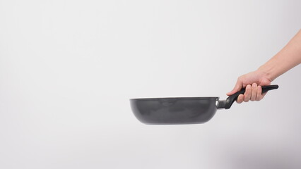 Pan cleaning. Man hand on white background cleaning the non stick pan with handy dish washing...