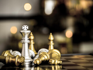 golden king surrounded with silver chess pieces on chess board game competition with communication technology network background. Team leader, business strategy, chess battle, victory concept.