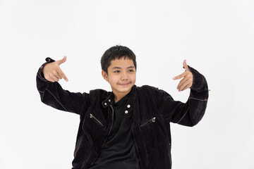 Portrait of smiling child boy doing hip hop movements during class in dance center on white background