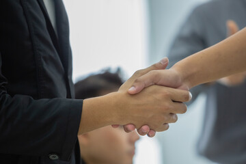 businesspeople shaking hands partnership connection agreement success.