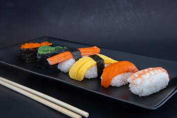 Nigiri sushi set on black plate