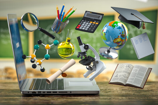E-learning online education concept. Open laptop and sіchool supplies and accessoires  in a classroom. n