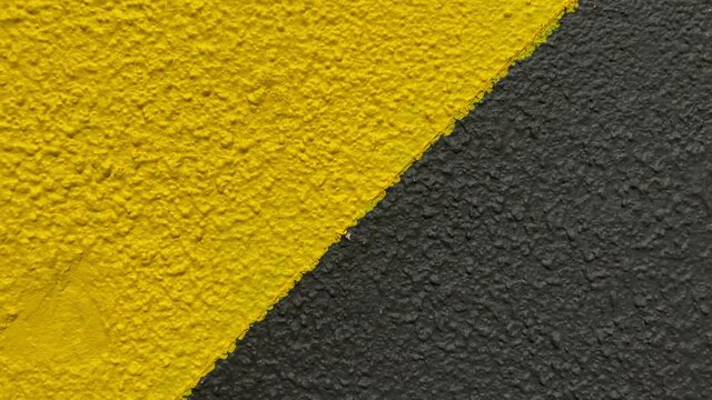 Natural textured wall, abstract background of yellow and black colours.