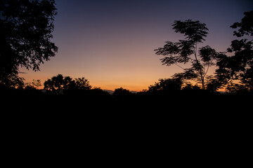 The sunrise and the mountains represent the beautiful nature.