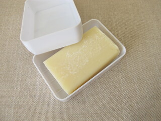 A vegan soap bar made from natural vegetable oil in a soap dish