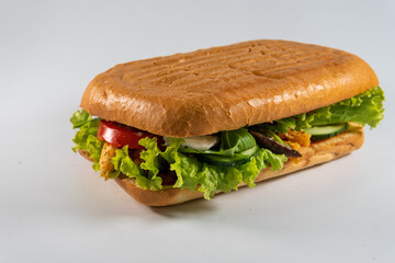 ciabatta sandwich with chicken and vegetables isolated on white background. Concept for the production of fast food bread. Bakery products