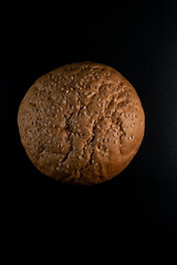 Bun, hamburger bread without ingredients. Concept for the production of fast food bread. Bakery products. Copy space. Top down view. Vertical photo.