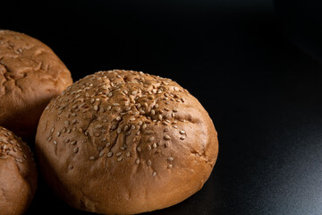 Bun, hamburger bread without ingredients. Concept for the production of fast food bread. Bakery products. Copy space
