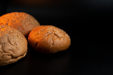 Bun, hamburger bread without ingredients. Concept for the production of fast food bread. Bakery products. Copy space