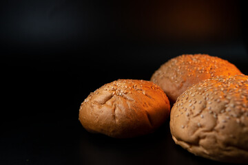 Bun, hamburger bread without ingredients. Concept for the production of fast food bread. Bakery products. Copy space