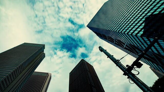 A timelapse of clowd at the building in the business town wide shot panning