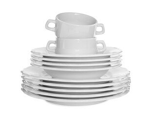 Stacked plates and cups on white background