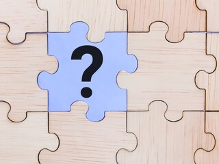 Question mark concept. Question mark symbol on jigsaw puzzle.
