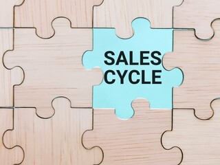 Business concept. Phrase sales cycle written on jigsaw puzzle.