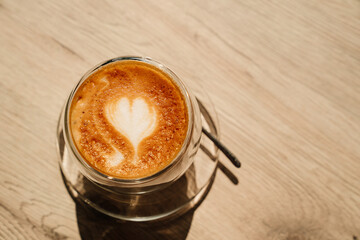 a cup of coffee with a pattern of heart. beautiful serving of hot drinks.