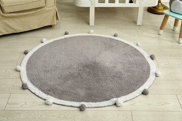 Fototapeta na wymiar Stylish soft rug on floor in room