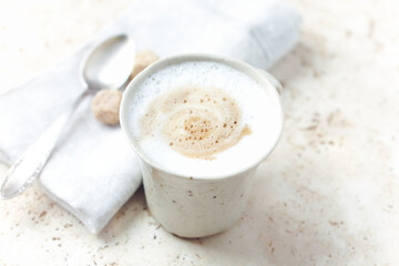 Obraz na płótnie Canvas Coffee with milk on bright stone background. Close up. 