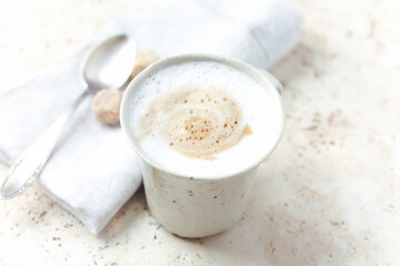 Coffee with milk on bright stone background. Close up.	