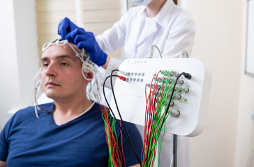 Patient brain testing using encephalography at medical center