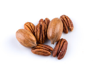 Few pecan nuts isolated on white