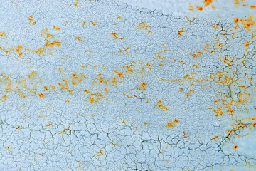 Blue and orange grunge pattern of natural rusty enamel paint crackle. Cool texture of cracks, stains, scratches, splash, etc for print and design. Crackle paint overlay.
