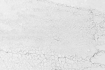 Black and white grunge pattern of natural enamel paint crackle. Cool texture of cracks, stains,...