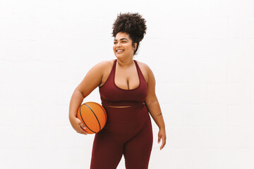 Fototapeta na wymiar Fitness woman with basket ball