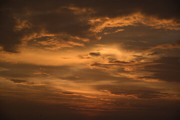 Beautiful, stunning golden sky during the sunset at Promthep Cape landmark viewpoint in Phuket