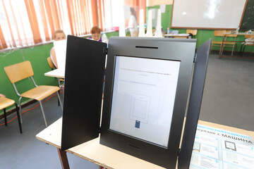 Machine for voting with sign “Bulgarian elections for parliament, 2021” and instructions for...
