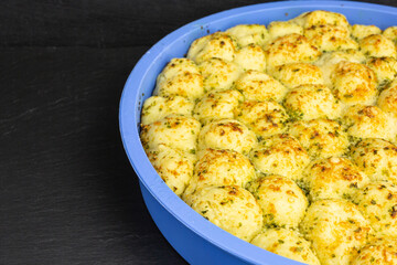 freshly baked yeast bubble bread with parmesan cheese and parsley