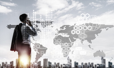 Concept of business success and control with confident boss against cityscape background