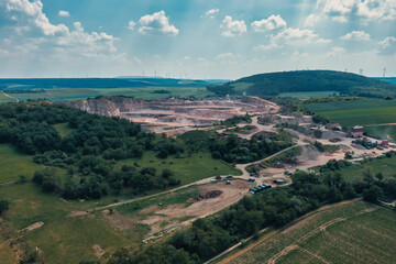 Obraz premium View from above of a gravel plant in the middle of a forest area in Rhineland-Palatinate / Germany 
