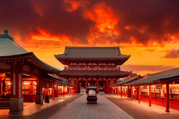 Japan, Tokyo. Asakusa Temple in red. Sensoji Temple under red sky. Buddhism concept. Buddhist temple without people. Asakusa Street with souvenir shops. Hand washing bowl in front of Buddhist temple - obrazy, fototapety, plakaty
