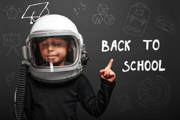 The child plans to go back to school wearing an astronaut helmet to become an astronaut