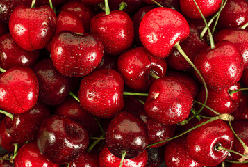background of cherries in drops of water close-up