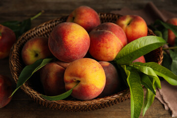 Fresh ripe juicy peaches on wooden table, closeup