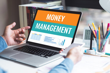 Money management and financial plan concepts with text on laptop.