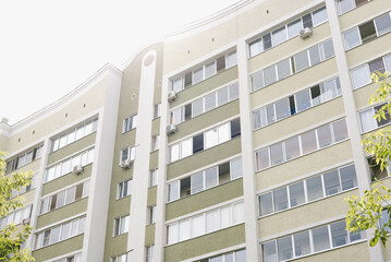 Fototapeta premium New house. Colored high-rise building. Apartment house. New building. 