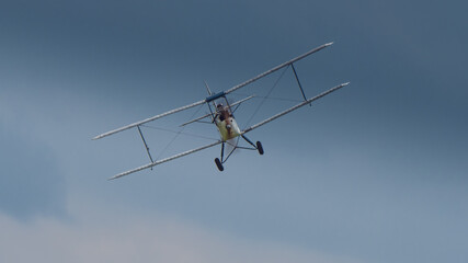 A vintage classic Biplane aircraft in flight