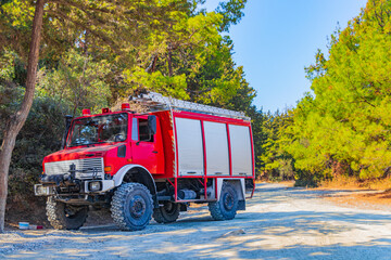 Red fire truck on Filerimos hill Ialysos forest Rhodes Greece.