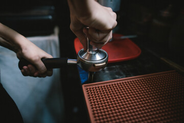 barista using a coffee press Compressed coffee for a smooth taste. before leading to the process of brewing for customers.