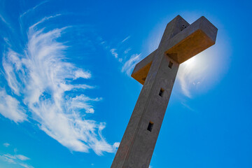 Fototapeta premium Monastery Filerimos Cross on hill Ialysos Rhodes Greece blue background.