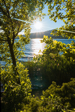 Spring sunset on the shores of Lake Pusiano, near the town of Bosisio Parini, Italy - May 2021.